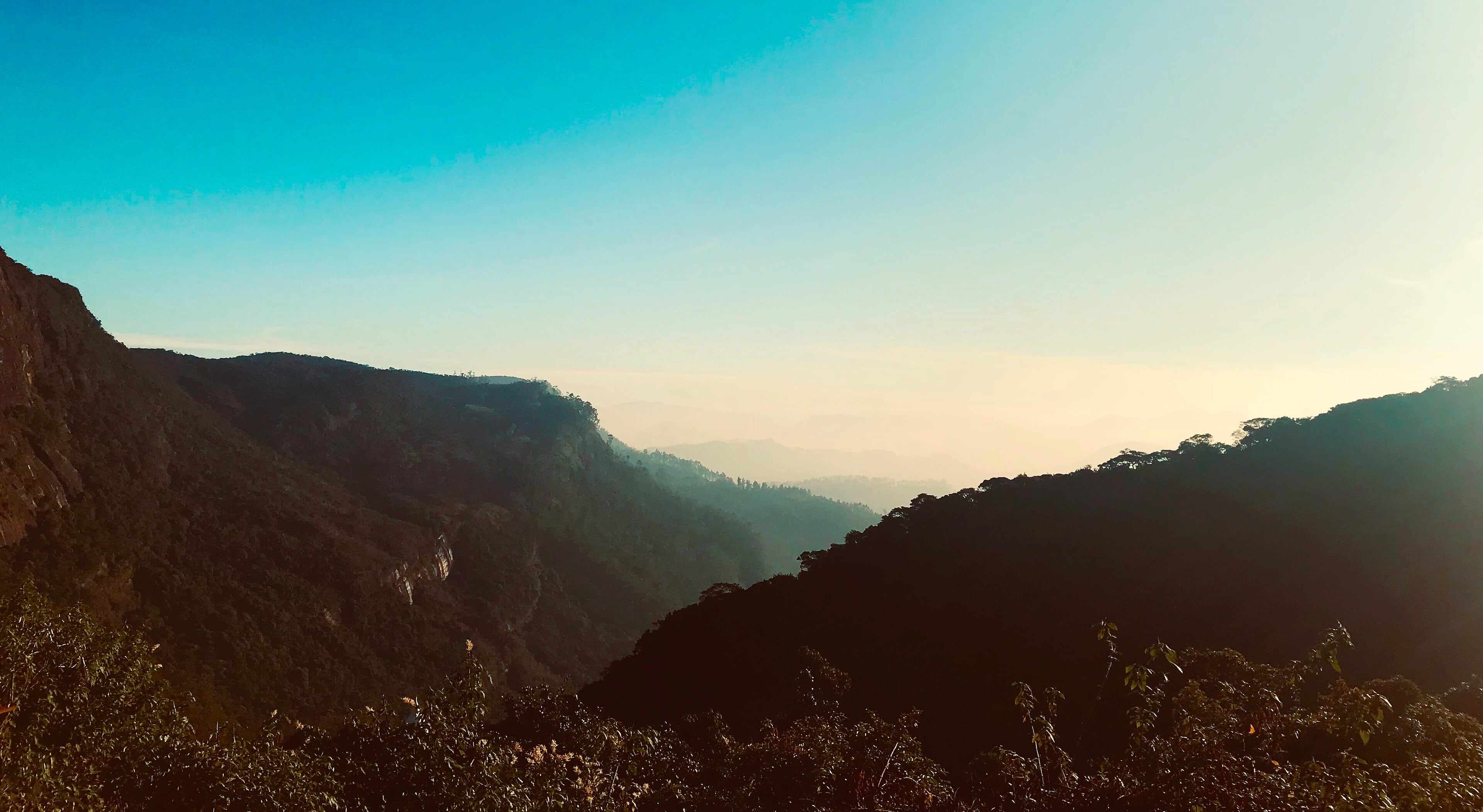 Sunrise light over the ridges seen from Adam’s Peak (Sri Pada)