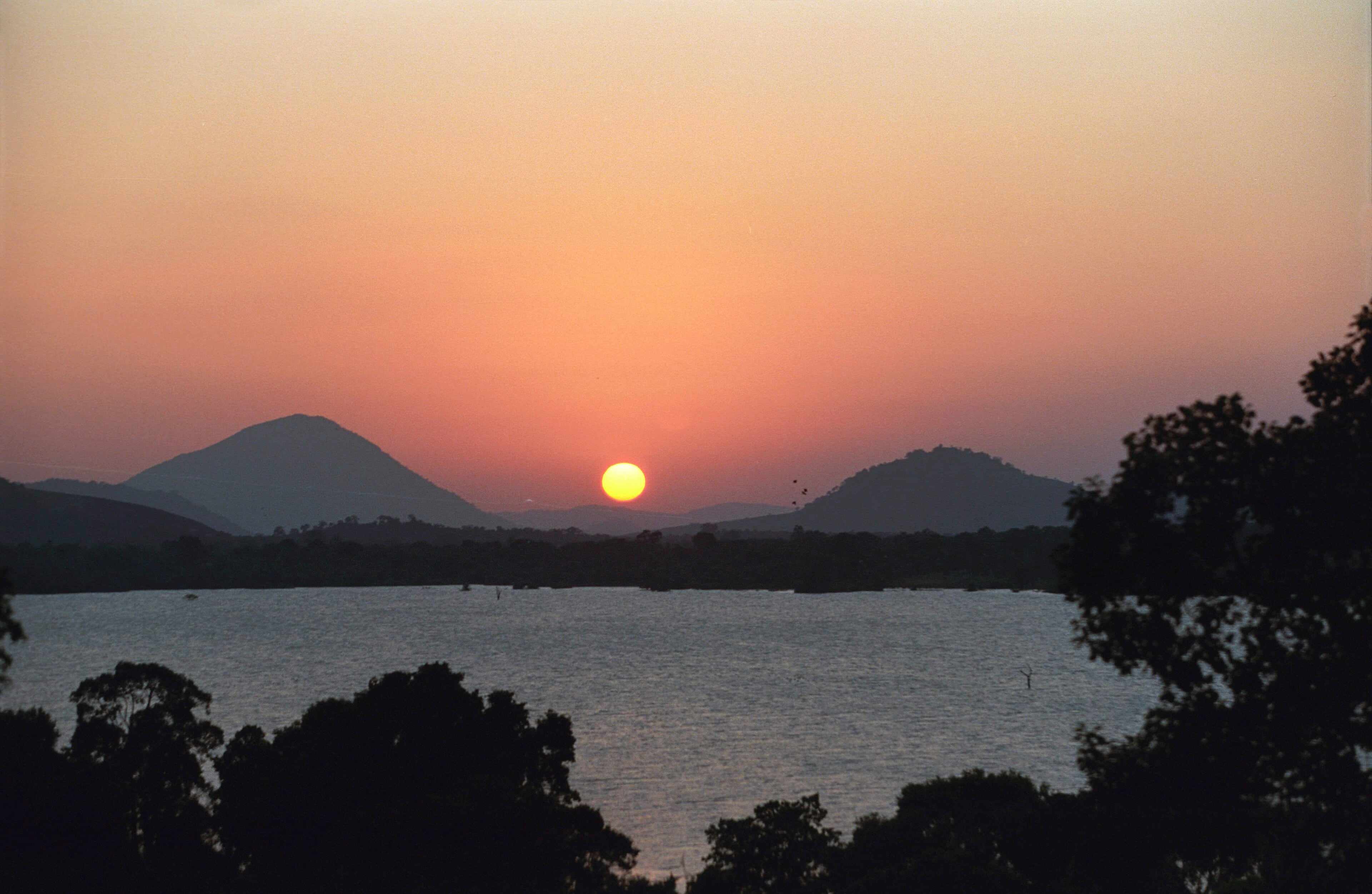The sun setting over Kandalama lake near Dambulla