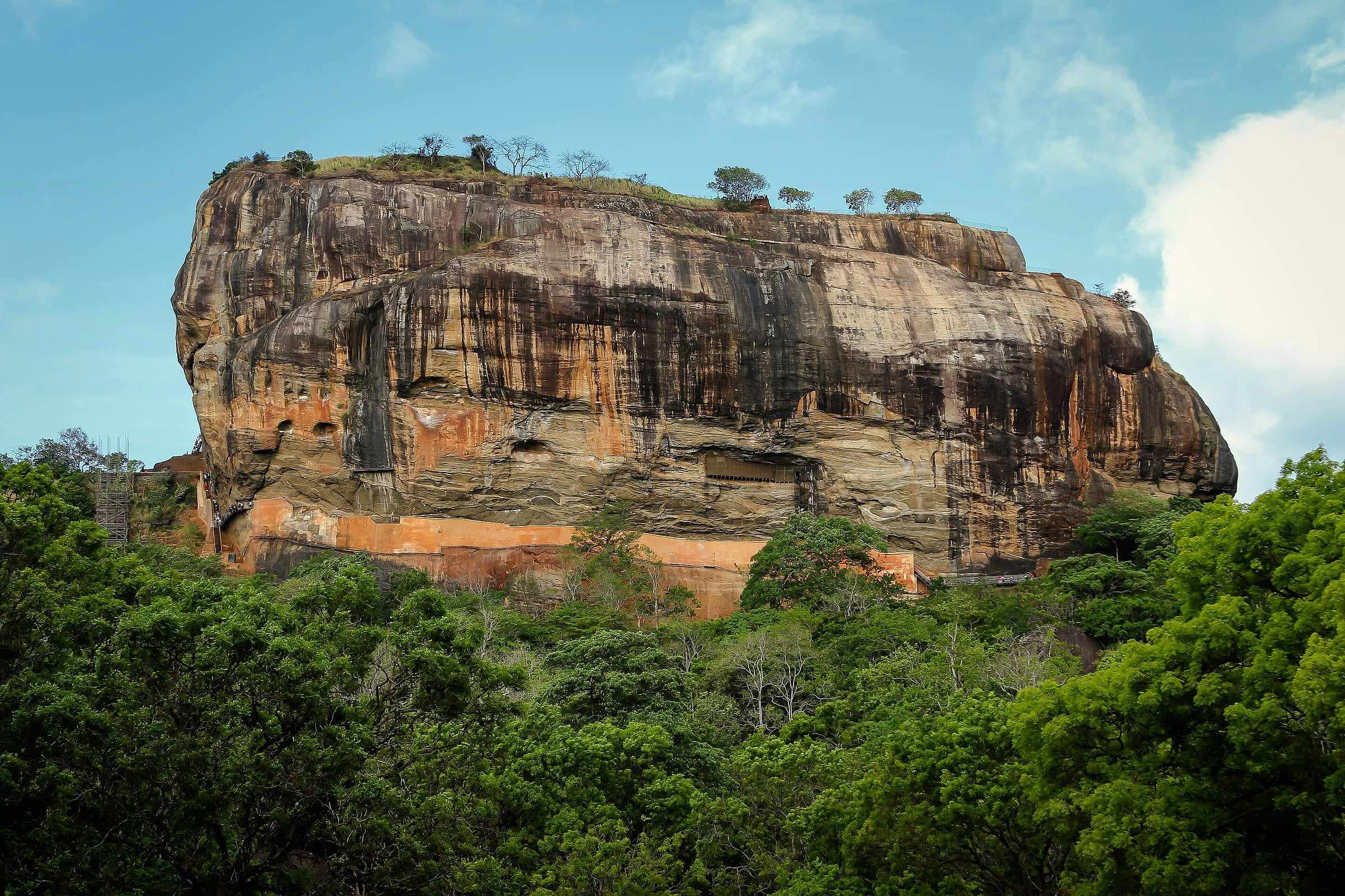 The rock fortress of Sigiriya rising above the forest